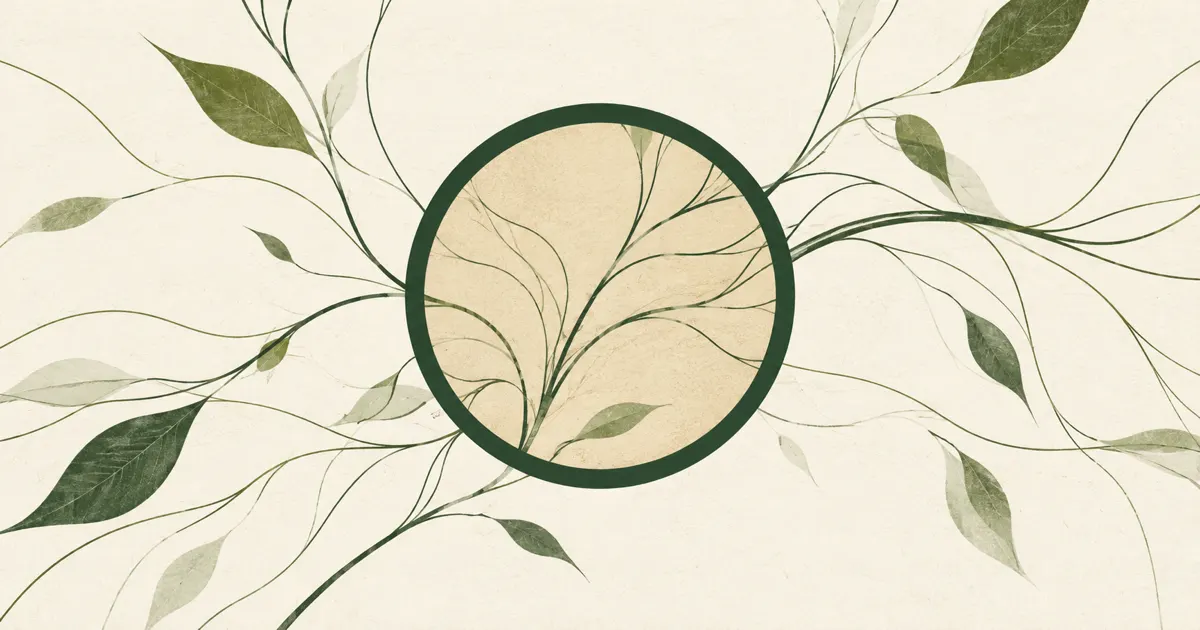A circular lens shape over fine green lines on sand